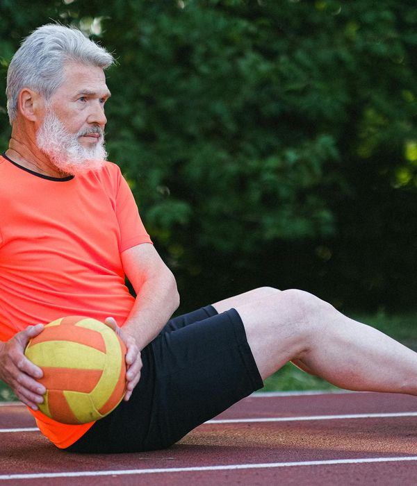 A man focused during a functional training exercise, showing concentration.